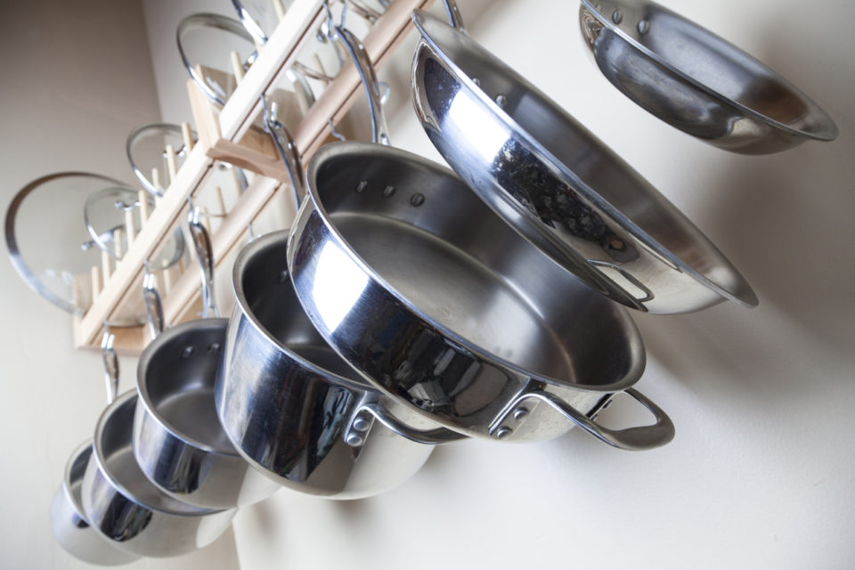 Hanging Pots and Pans on wall in kitchen
