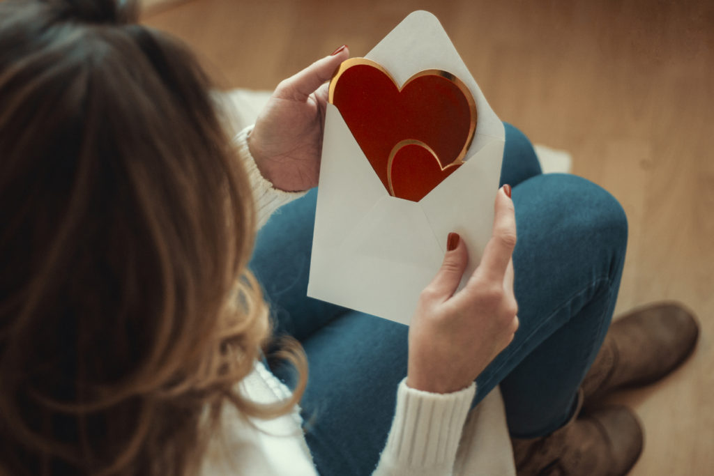 young woman with valentines card